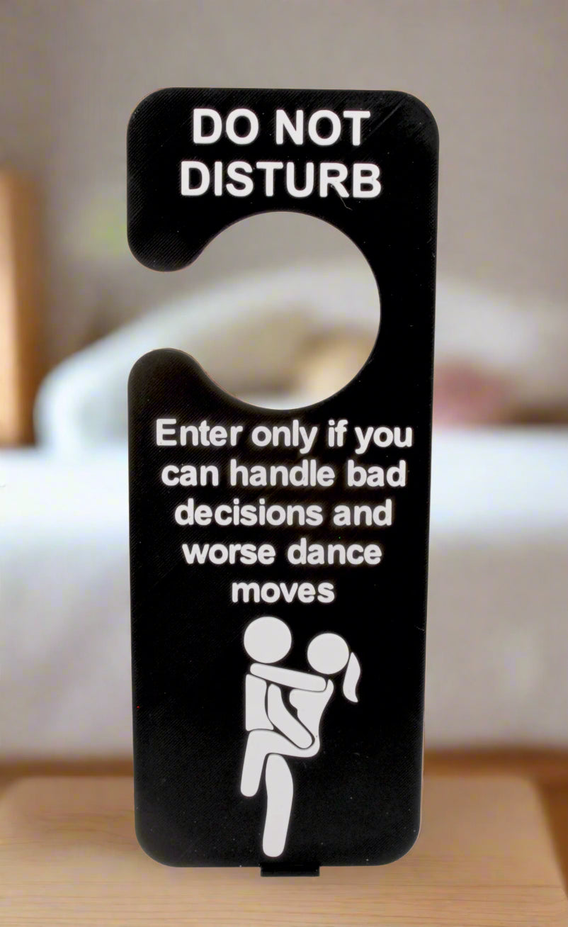 Door sign with humorous text and icon on a white background