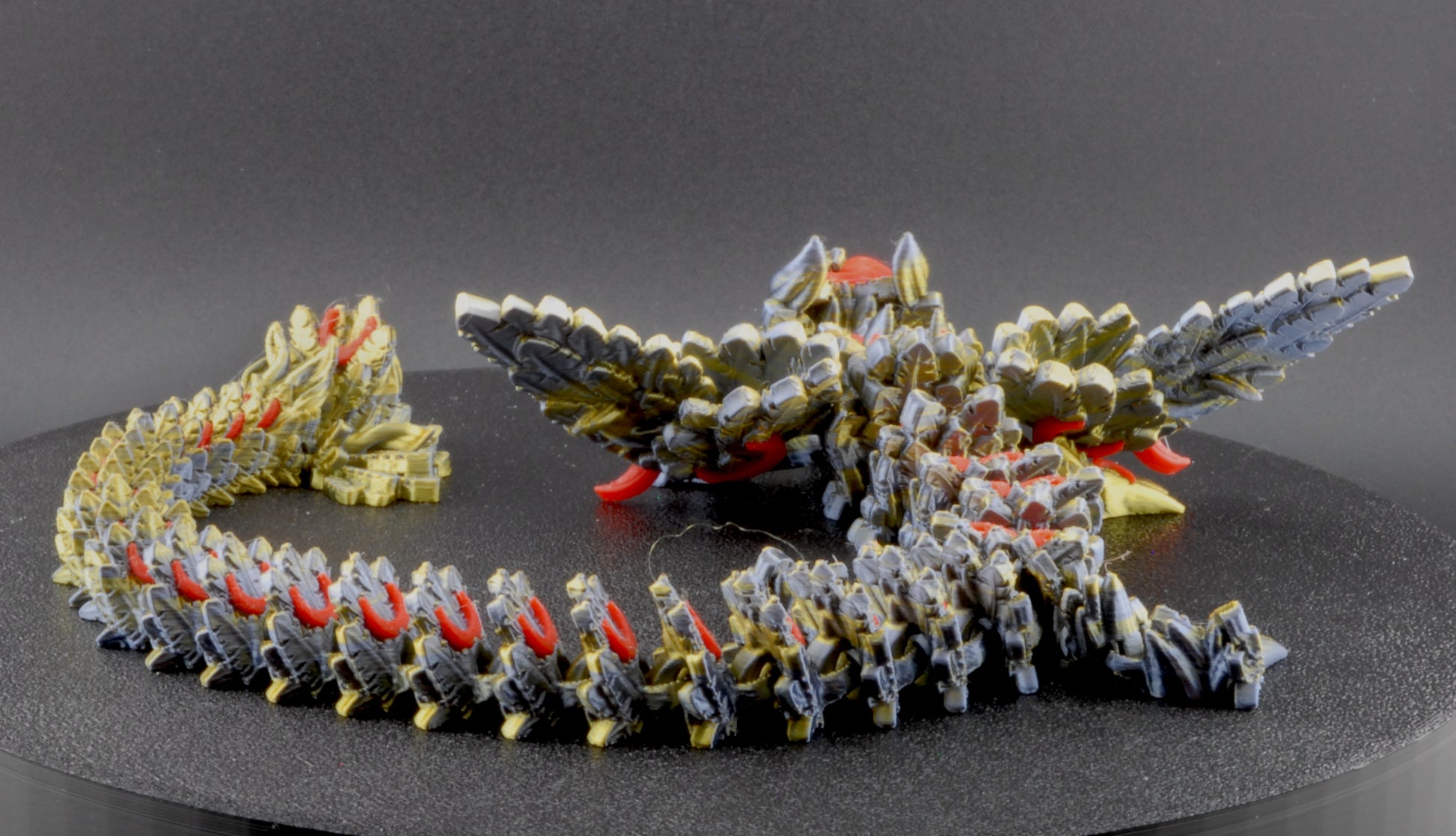 Model of a dragon-like creature on a gray background