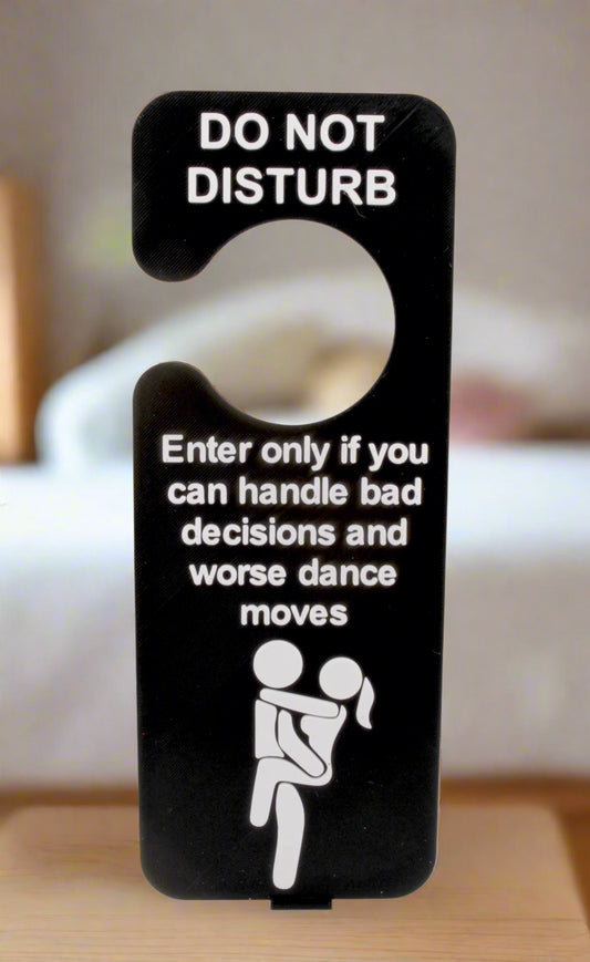Door sign with humorous text and icon on a white background