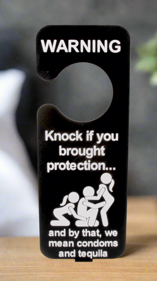 Door hanger with humorous warning text on a white background