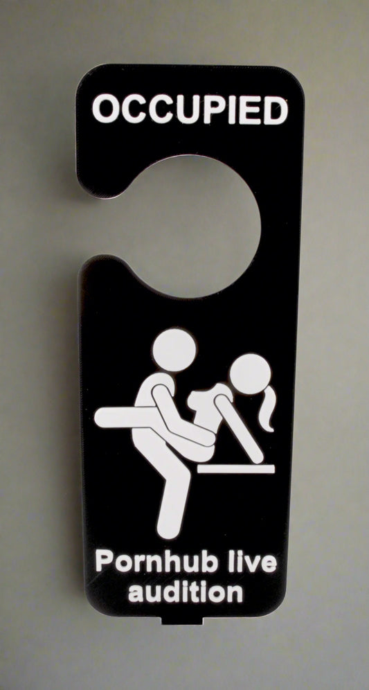 Door sign with 'Occupied' and 'Pornhub live audition' text on a white background