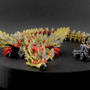 Model dragon sculpture on a black stand with a dark background