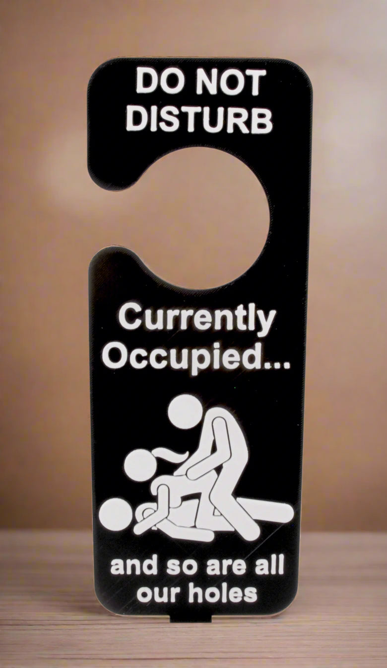 Door sign with humorous text and graphic on a white background